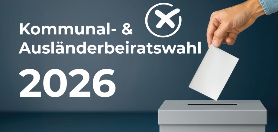 Hand throws ballot paper into grey ballot box in front of dark blue background with text 'Kommunal- & Ausländerbeiratwahl 2026