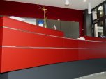 Red counter in the entrance area of the Citizens' Service Centre in the town hall, where visitors are welcomed.