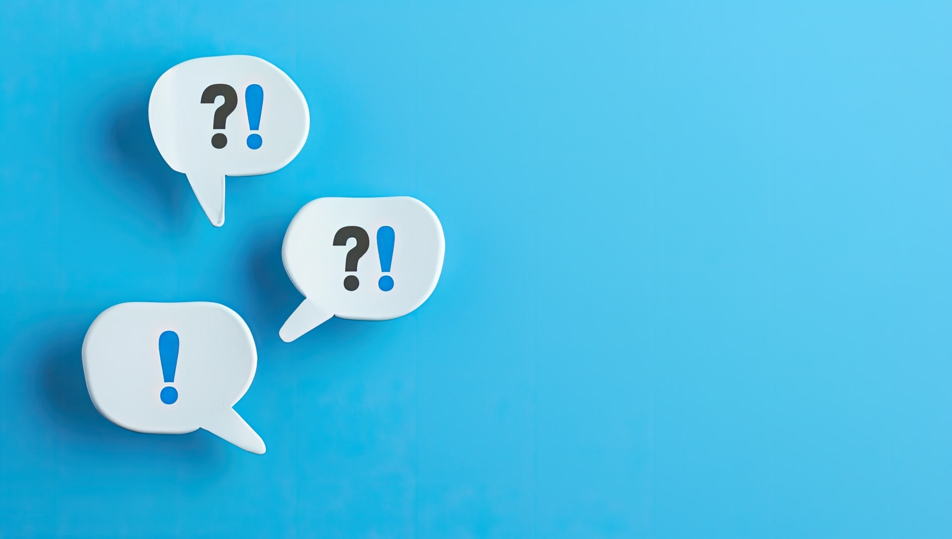 Two speech bubbles with exclamation and question symbols on a blue background. Two speech bubbles with exclamation and question symbols on a blue background.