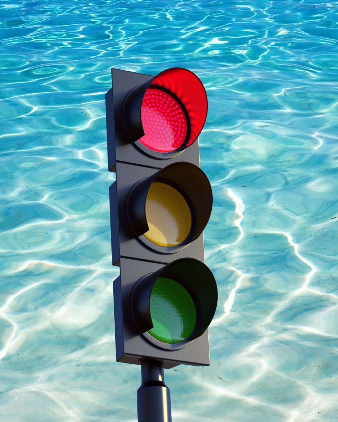 Eine rote Ampel vor klarem, welligem Wasser