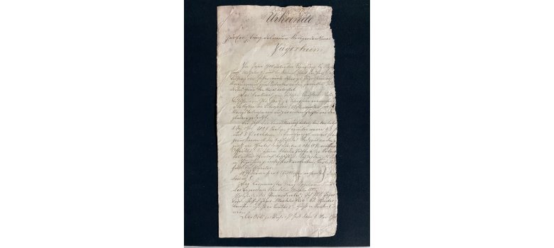 Alte Urkunde mit handschriftlichem Text zur Bestätigung eines Fundstücks in Jügesheim